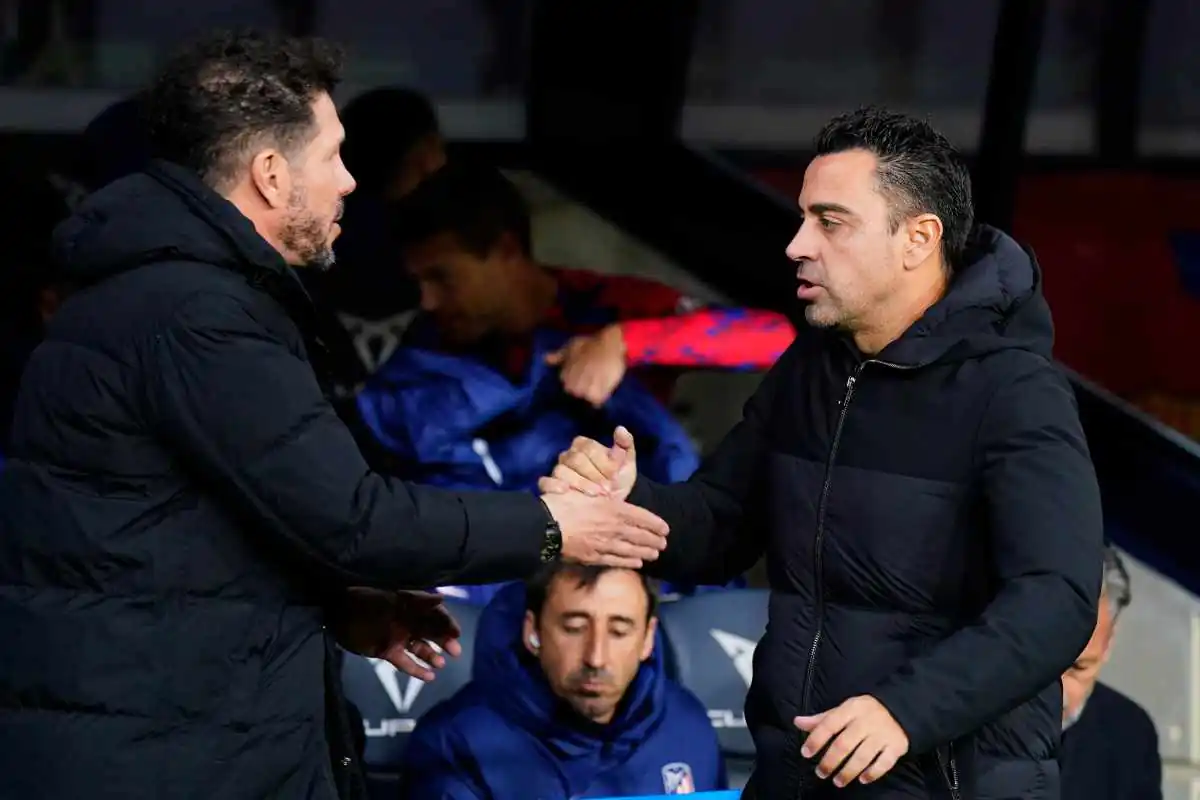 Simeone insieme a Xavi