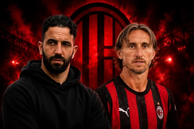 Luka Modric in maglia Milan e Ruben Amorim in abbigliamento tecnico davanti al logo rossonero